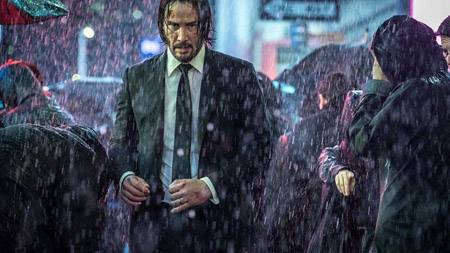Keanu Reeves as John Wick in rain.